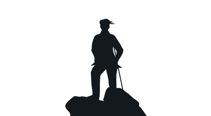 A silhouette of a person holding a cane standing on a rock.